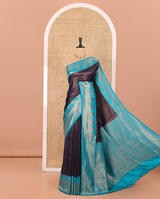 Navy Blue Luxury Soft Silk Saree Accentuated with 1000 Zari Buttas All Over Its Body, Complemented by a Contrast Temple Zari Border, Grandly Woven Pallu of Jaal Designs, and Paired with a Contrast Jacquard Blouse