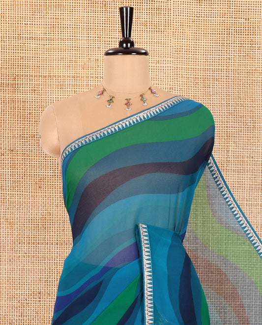 Blue Georgette Saree Colorfully Printed with Leheriya-Style Stripes, Subtly Temple Motifs Sequin Embroidered Piping Border, and Paired with a Matching Diamond-Patterns Printed Blouse