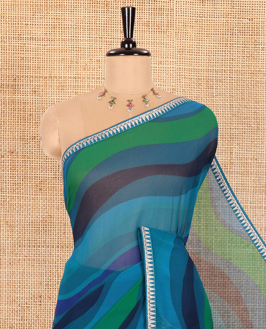 Blue Georgette Saree Colorfully Printed with Leheriya-Style Stripes, Subtly Temple Motifs Sequin Embroidered Piping Border, and Paired with a Matching Diamond-Patterns Printed Blouse