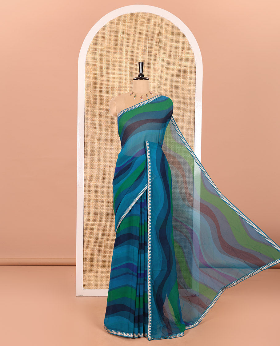 Blue Georgette Saree Colorfully Printed with Leheriya-Style Stripes, Subtly Temple Motifs Sequin Embroidered Piping Border, and Paired with a Matching Diamond-Patterns Printed Blouse