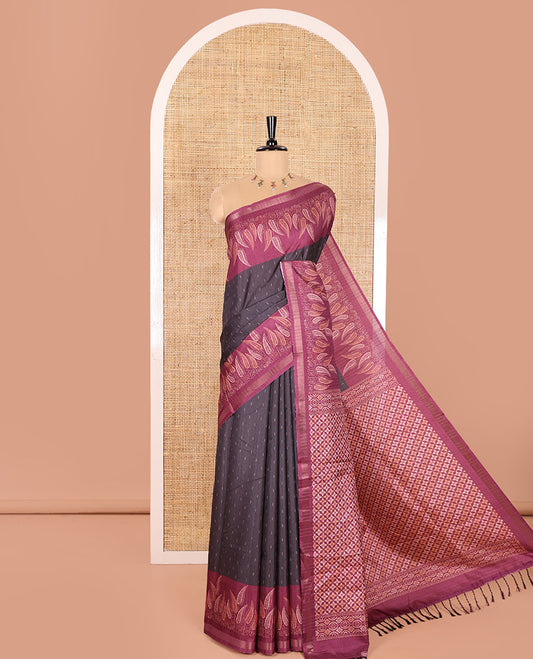 Black Katan Silk Saree Adorned with Dobby-Style Buttas All Over Its Body, Complemented by a Contrast Border of Leaf Pattern Prints, an Intricately Designed Pallu of Jaal Designs, and Paired with a Contrast Blouse