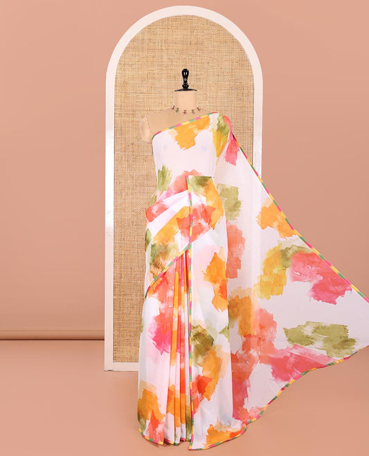 Cream Chiffon Saree, Vibrantly Printed with Abstract Holi-Style Color Splashes Prints All Over Its Body, Thin Piping Border, Pallu Picturing the Same Print, and Paired with a Contrast Blouse
