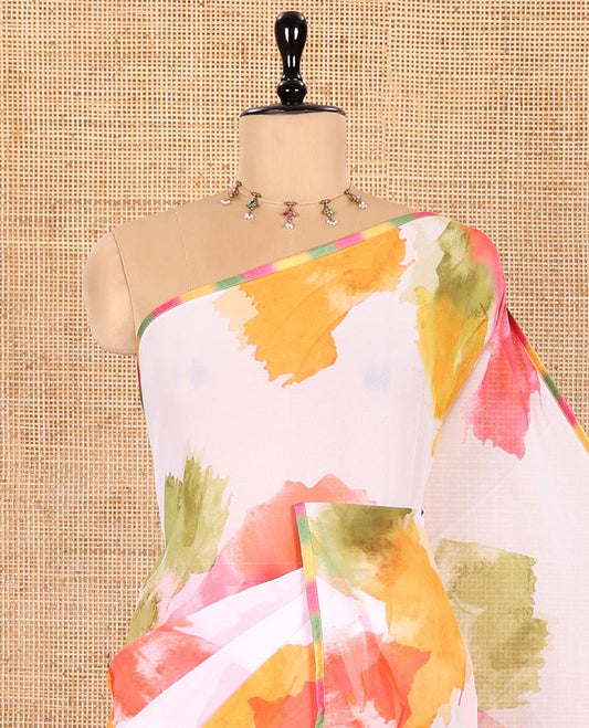 Cream Chiffon Saree, Vibrantly Printed with Abstract Holi-Style Color Splashes Prints All Over Its Body, Thin Piping Border, Pallu Picturing the Same Print, and Paired with a Contrast Blouse