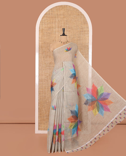 Borderless Chikku Linen Cotton Saree, Artfully Detailed with Kaleidoscope-Colored Flower-Shaped Leaf Motifs Print, Pallu Mirrors the Same Print, and Paired with a Matching Printed Blouse