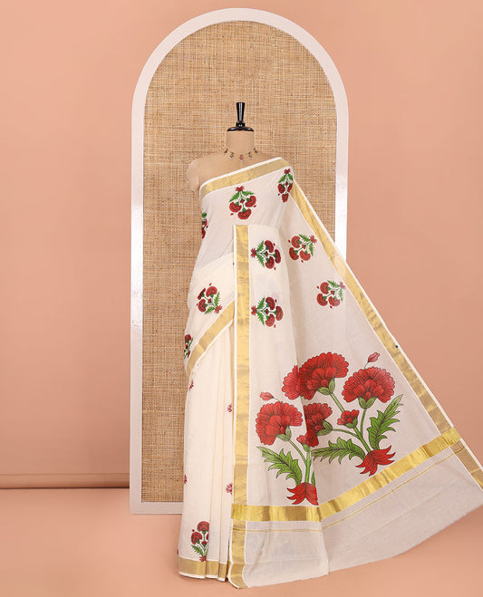 Cream and Red Kerala Cotton Saree, Detailed with Bunch of Floral Motifs Printed on Its Body, Subtle Zari Border, Pallu Features a Big Bunch of Floral Motifs Print, and Paired with a Matching Blouse