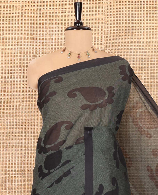 Borderless Black-Green Coimbatore Cotton Saree, Adorned with Paisley Motifs Printed on Its Body, Pallu Intricately Printed with Geometric Motifs, and Paired with a Matching Blouse