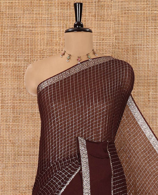 Scintillating Brown Viscose Georgette Saree Gleamed Up with Checked Design on Its Body, Highlighted by a Double-Pet Border, Zari Checked Design Pallu, and Paired with a Matching Blouse