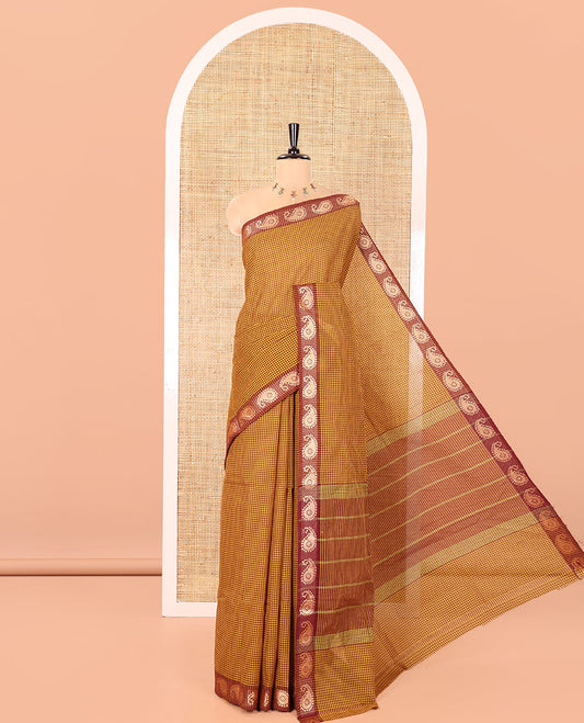 Mustard Chettinad Cotton Saree, Adorned with Checked Design on Its Body, Complemented by a Contrast Paisley Border, Subtly Striped Pallu, and Paired with a Matching Blouse