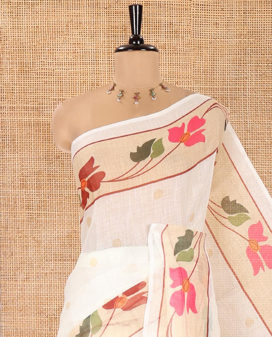 Cream Linen Cotton Saree, Subtly Sparkled with Zari Buttas All Over Its Body, Highlighted by Contrast Floral Creeper Design Border, Subtle Pallu and Paired with a Striped Blouse