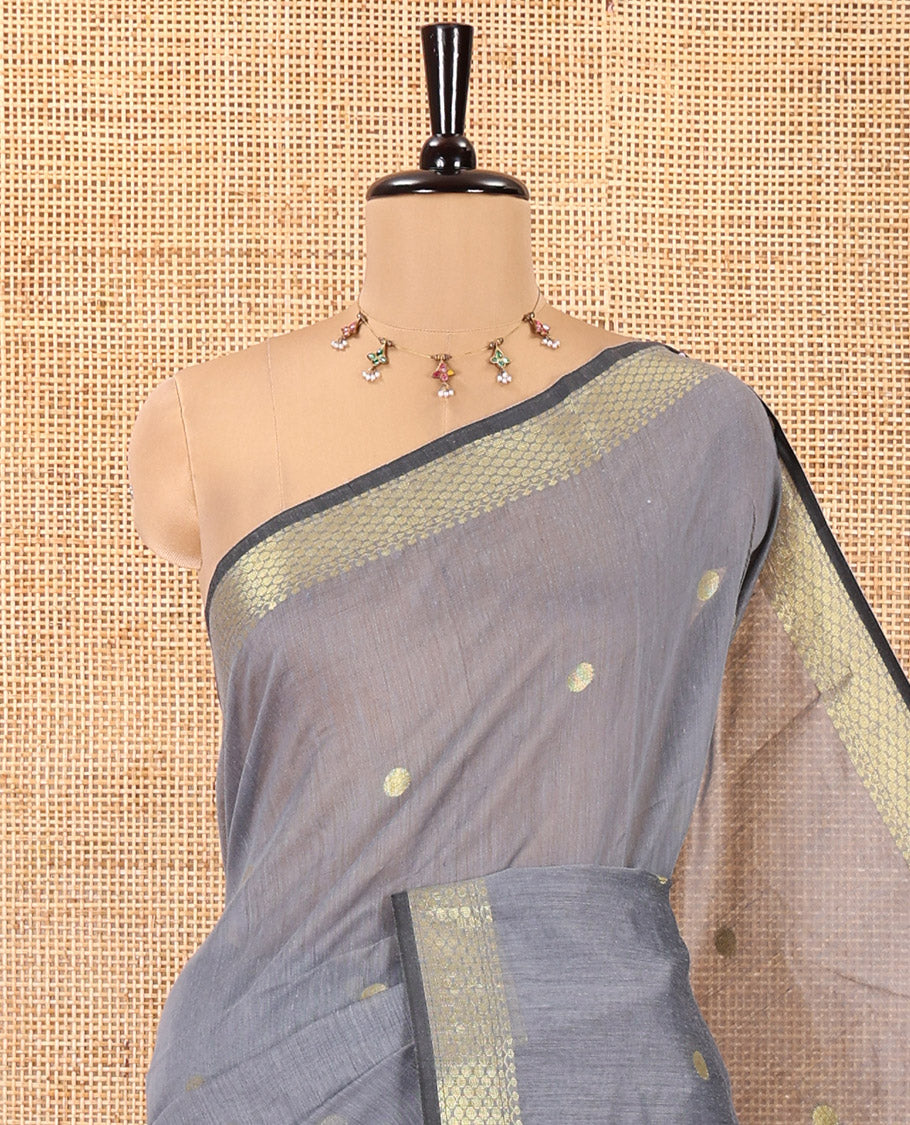 Grey Maheshwari Cotton Saree, Adorned with Flower Buttas All Over Its Body, Highlighted by Traditional Zari Border, Complemented by Contrast Pallu of Floral Buttas, and Paired with a Contrast Blouse