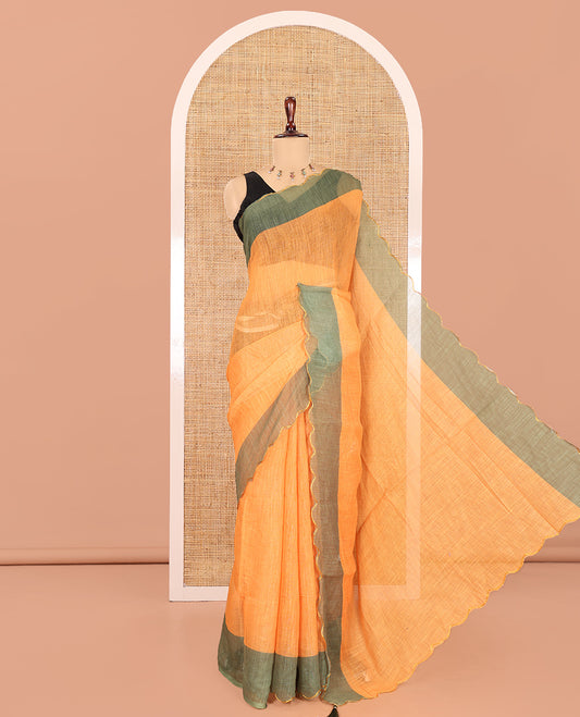 Yellow Plain Linen Cotton Saree, Contrast Plain Scallop Border, a Self-Pallu, and Contrast Kalamkari Printed Blouse