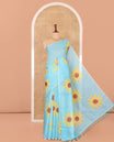 Sky Blue Linen Cotton Saree, Impeccably Styled with Sunflower Motifs Print, a Piping Border, and a Contrast Blouse