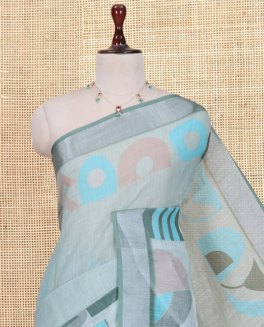 Pista Green Plain Linen Cotton Saree, Complemented by Geometric Printed Zari Border, and a Matching Blouse