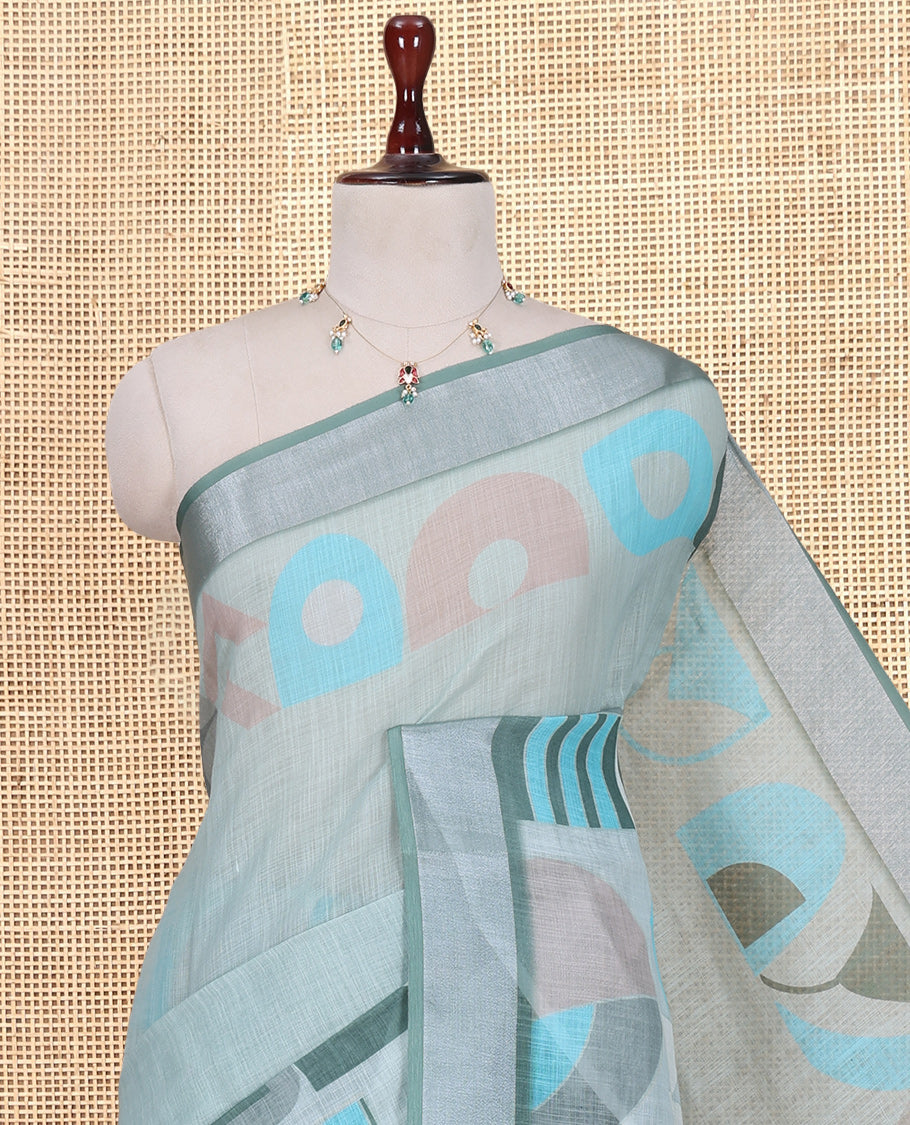 Pista Green Plain Linen Cotton Saree, Complemented by Geometric Printed Zari Border, and a Matching Blouse