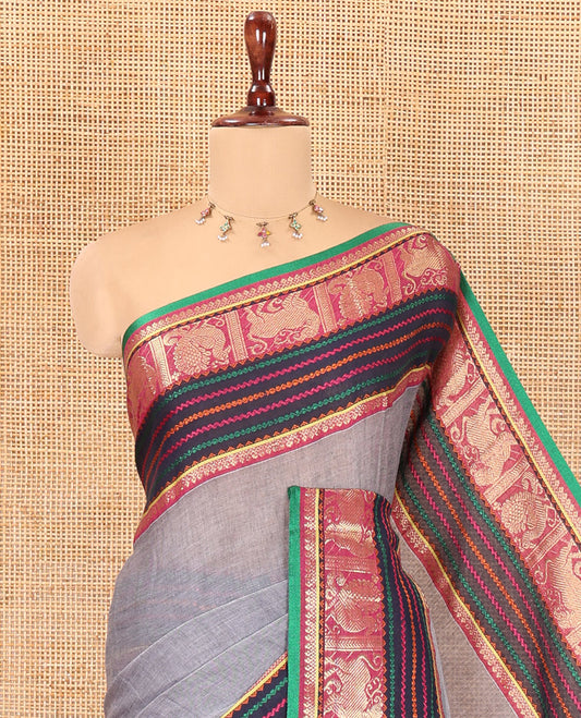 Grey Plain Khadi Mul Cotton Saree, Complemented by Contrast Yaali-Peacock Traditional Border, Self-Pallu, and No Blouse