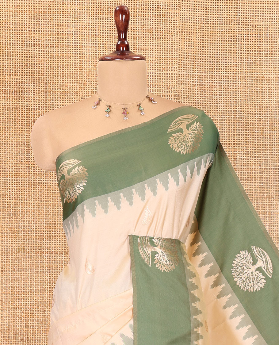 Cream Elite Soft Silk Saree, Woven with Zari Buttas, a Contrast Tree Motifs Temple Border, Paithani-Style Woven Pallu, a Contrast Blouse