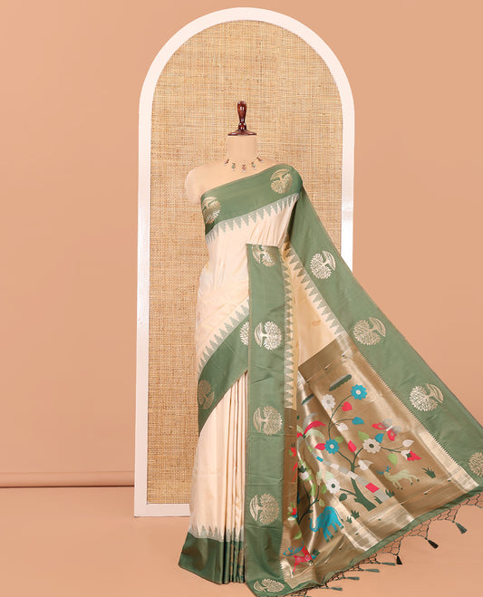 Cream Elite Soft Silk Saree, Woven with Zari Buttas, a Contrast Tree Motifs Temple Border, Paithani-Style Woven Pallu, a Contrast Blouse