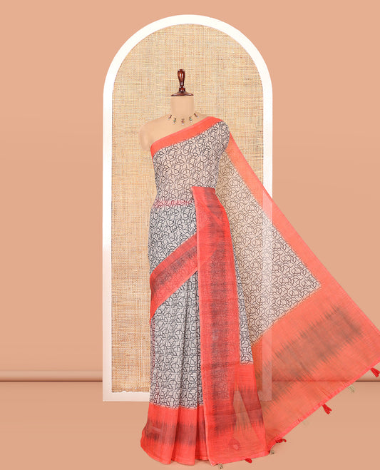 Chikku-Orange Linen Cotton Saree, Decorated with Intricate Print, a Contrast Ikat Border, Printed Pallu, and Contrast Blouse