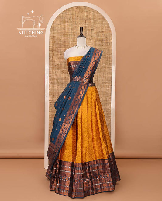 Mustard semi-banaras half-saree, embossed & contrast traditional zari border skirt,blouse of embossed & zari work & contrast-blue zari design dhavani