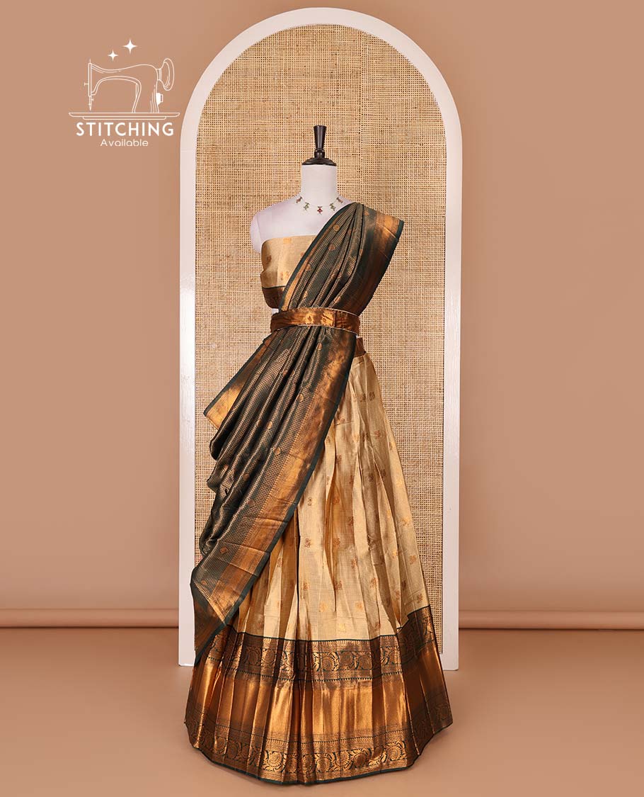 Gold banaras half saree, zari buttas with contrast bottle green traditional zari border skirt, matching blouse, dhavani of zari checks, and buttas