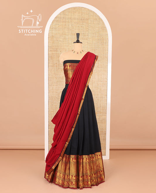 Black half-saree, plain with contrast traditional zari border skirt, matching blouse and a contrast zari border dhavani