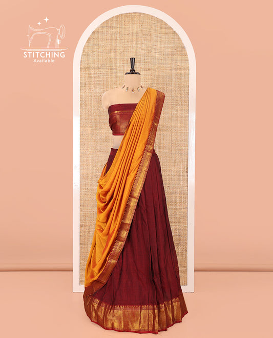 Maroon Mercerised Cotton Half-Saree Features Plain with Contrast Traditional Zari Temple Bordered Skirt, Paired with a Matching Blouse, and Comes with a Contrast Zari-Bordered Dhavani