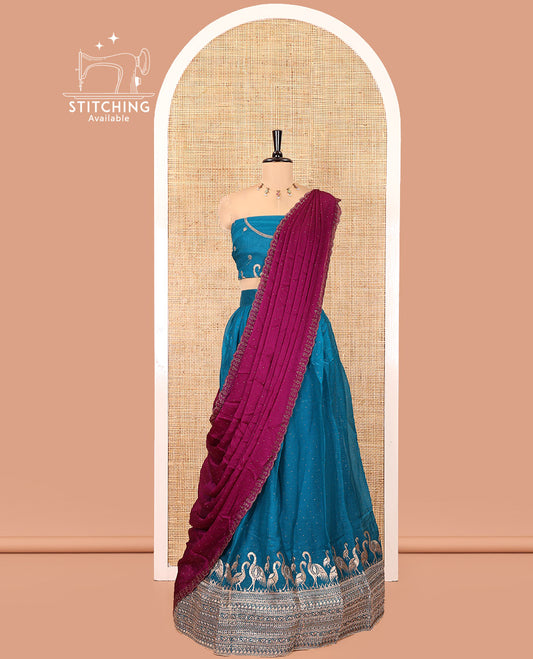 Blue Half-Saree Set, Mesmerized with Stone Work and Bird Motifs Embroidery on Its Satin Georgette Skirt, Highlighted by Embroidered Border, Paired with a Matching Blouse, and Comes with a Contrast Scallop Stone Work Dupatta