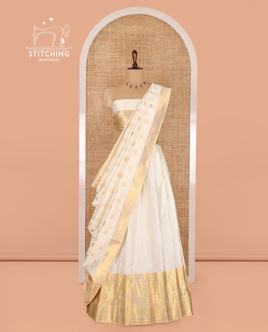 Cream Banarasi Silk Half-Saree Features a Plain Skirt, a Traditional Border, Matching Blouse, and Zari-Woven Dhavani