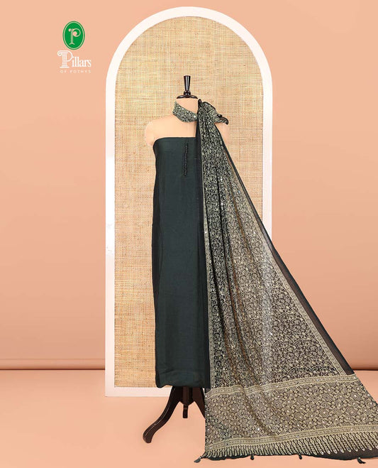 Bottle Green Material Chudidar Set, Subtly Woven with Pom-Pom Potli Neck Vichitra Silk Top, a Plain Santoon Bottom, Paired with Crushed Georgette Dupatta of Ajrakh Print and Mirror Work