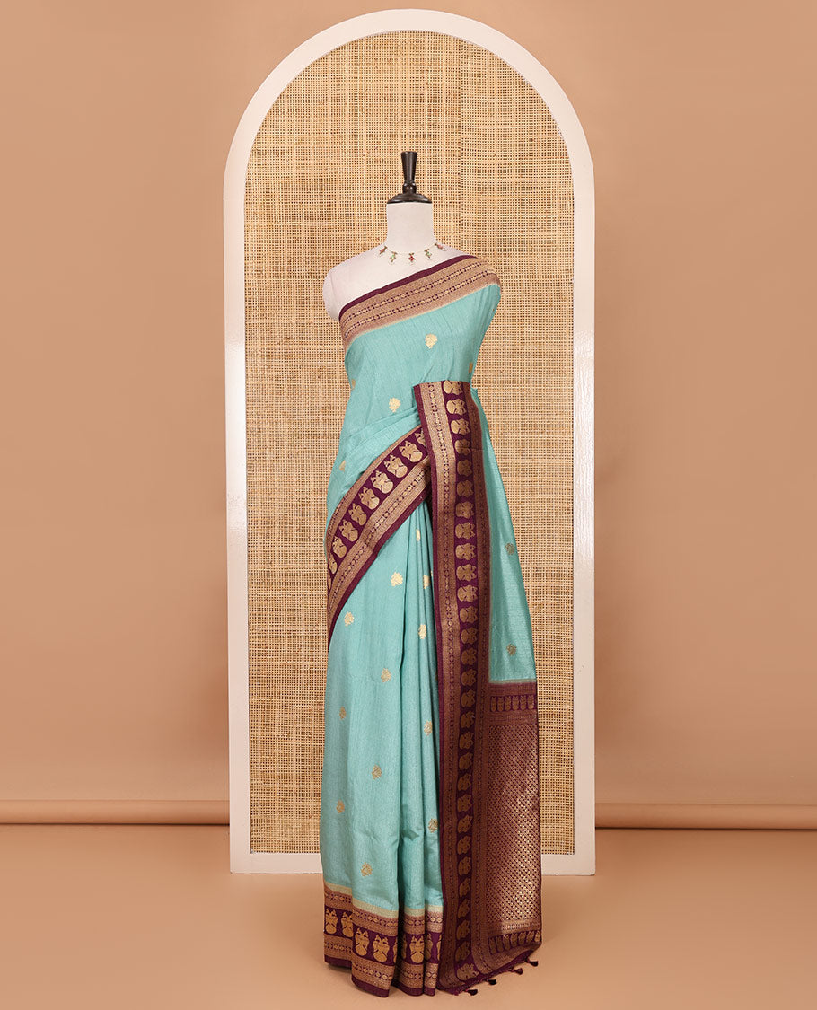 Sea blue peacock buttas dola silk saree, contrast rudraksham & iruthalai pakshi border, intricate pallu & contrast jacquard blouse