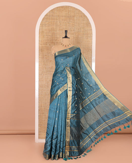 Peacock color zari buttas and striped banana pith saree, bavanji border, zari striped pallu, and a matching blouse
