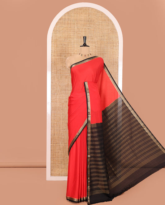 Red and Black Plain Semi-Mysore Silk Saree, Complemented by a Contrast Traditional Zari Design Border, Pallu Steeped with Gleaming Zari Stripes, and Paired with a Contrast Blouse