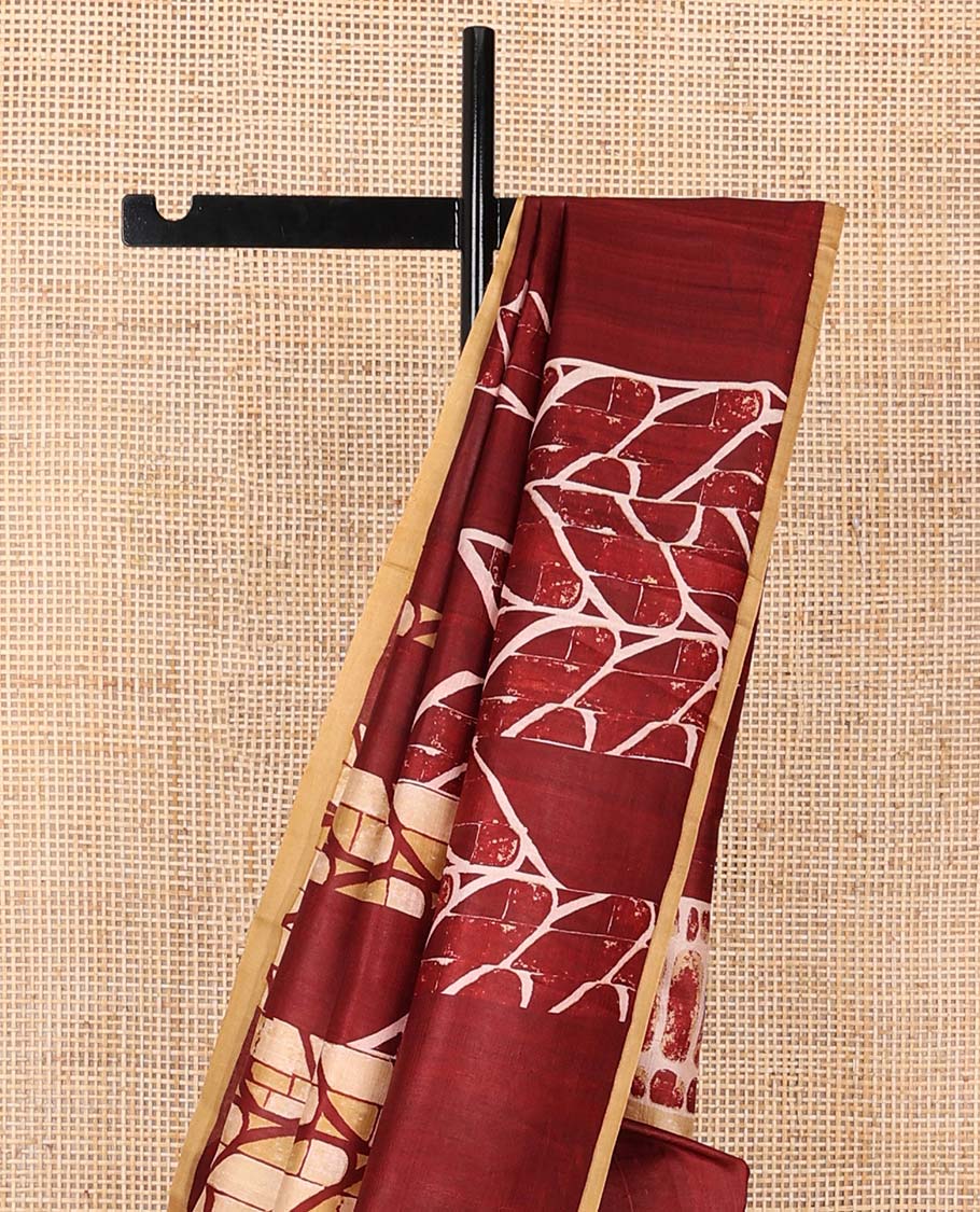 Maroon uniquely geometric printed silk saree with a contrast plain border & printed pallu