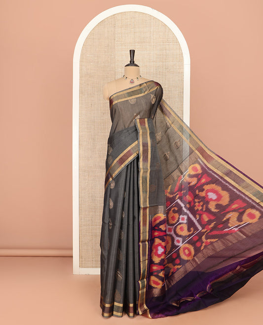 Grey Silk Cotton Saree Decorated with Zari Buttas All Over the Body, Highlighted with Ikkat Border, Contrast Pallu Elevated with Colorful Ikkat Weave, and Paired with a Contrast Blouse