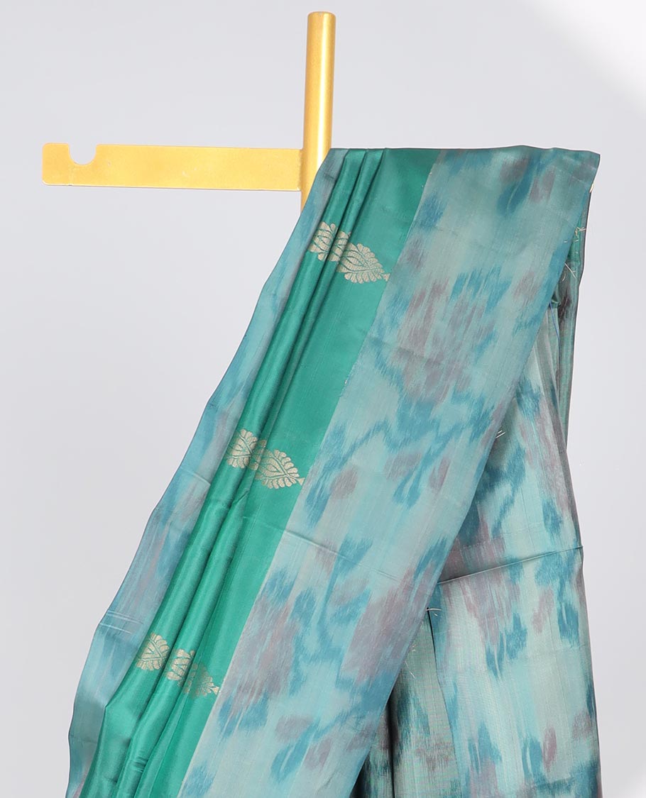 Green floral motifs semi-soft silk saree with contrast border & floral vine design pallu