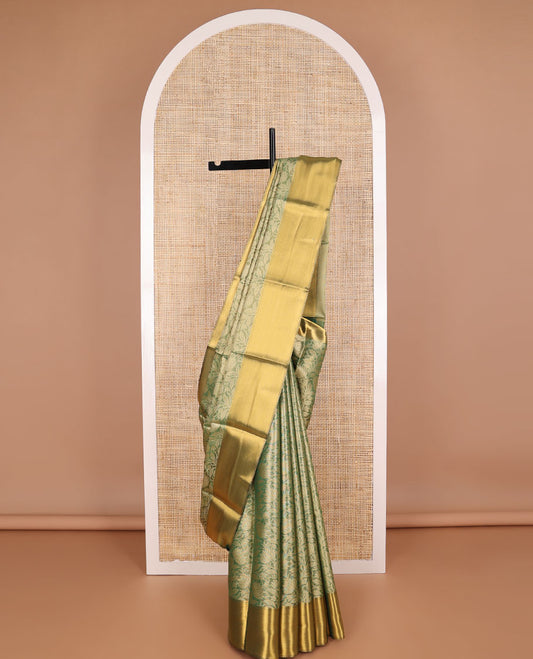Green floral jacquard tissue saree with contrast striped border & zari design pallu