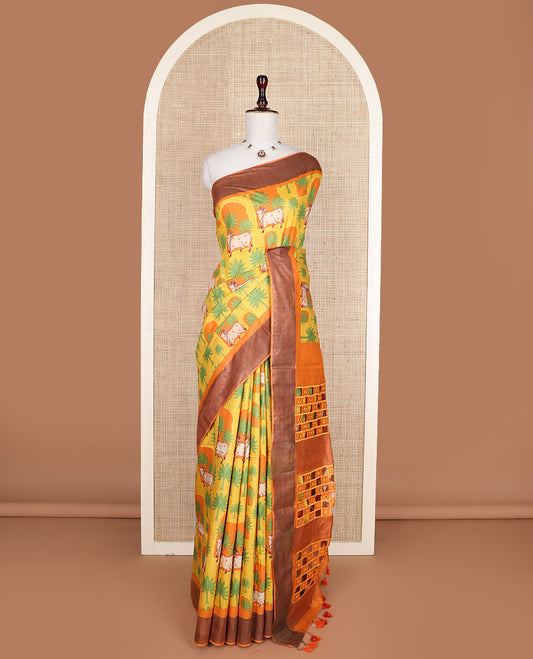 Yellow tree and Pichwai cow printed tussar silk saree, bavanji border, and checked pallu