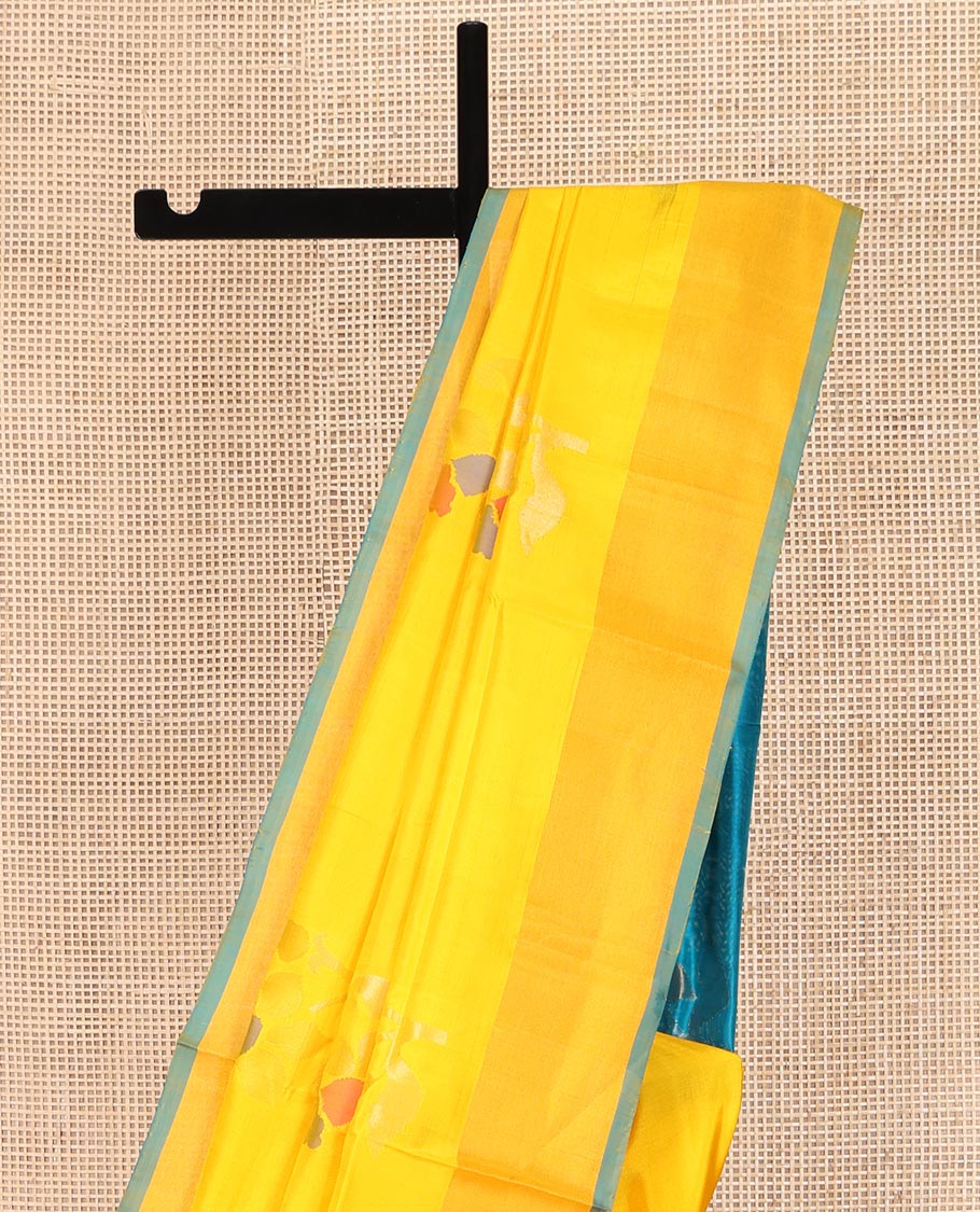 Yellow Uppada Silk Saree, Prettified with Floral Meena Buttas All Over Its Body, Subtle Plain Border, Complemented  by Contrast Pallu Steeped with Floral Meena Buttas, and Paired with a Contrast Blouse