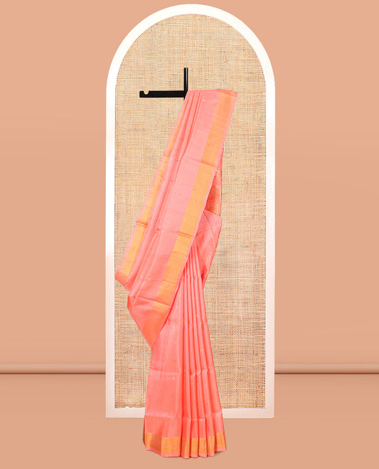 Coral Pink Uppada Silk Saree, Dazzled with Zari Buttas, a Bavanji Border, Grand Floral Jaal Pallu, and a Matching Blouse