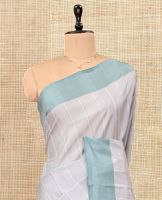 Light Grey Striped Uppada Silk Saree, Complemented by a Contrast Border, Plain Pallu, and a Contrast Blouse