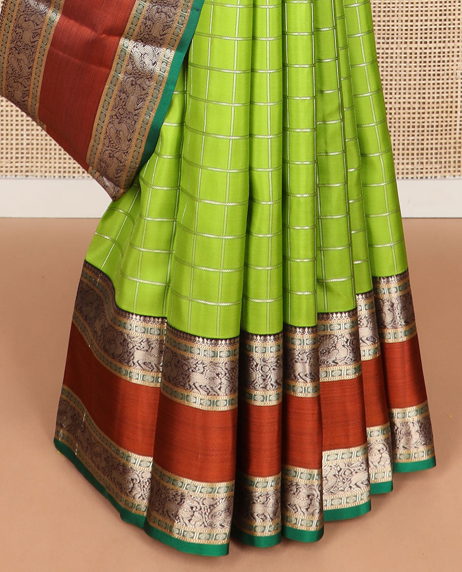 Green checked silk saree with contrast rettai pettu border of thilakam mokku, paun, muthu design & zari design pallu