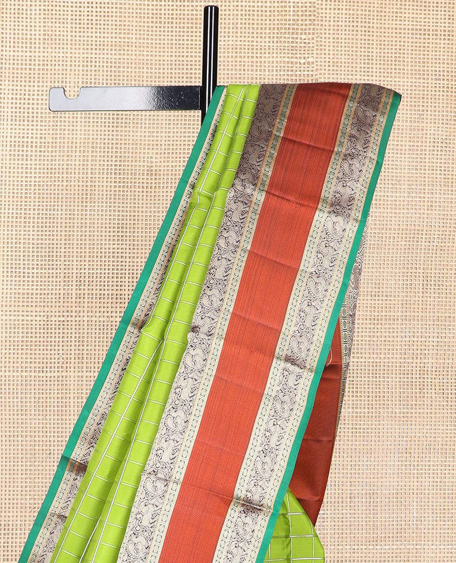 Green checked silk saree with contrast rettai pettu border of thilakam mokku, paun, muthu design & zari design pallu