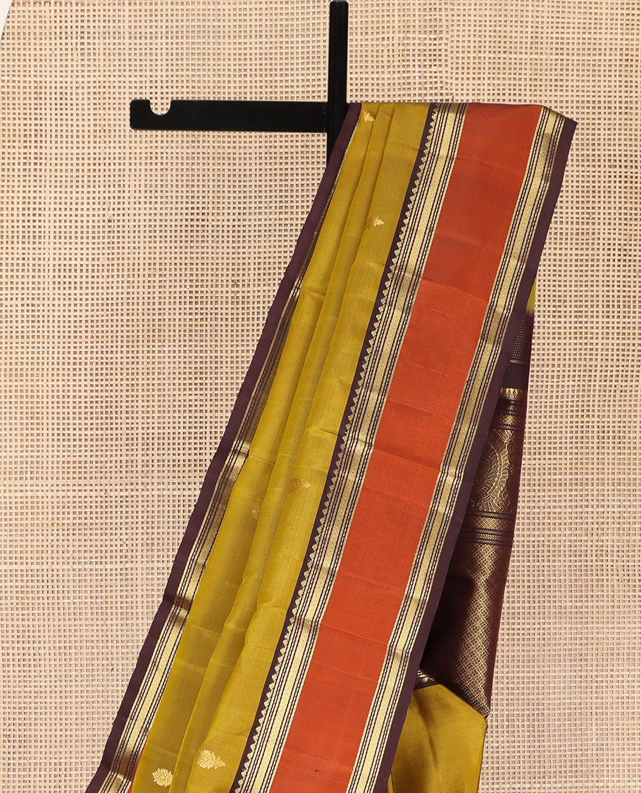 Green Vasundhara Silk Saree, Detailed with Zari Buttas All Over Its Body, Complemented by a Contrast Rettai Pettu Border of Traditional Designs, Grand Jaal Pallu, and Paired with a Contrast Blouse