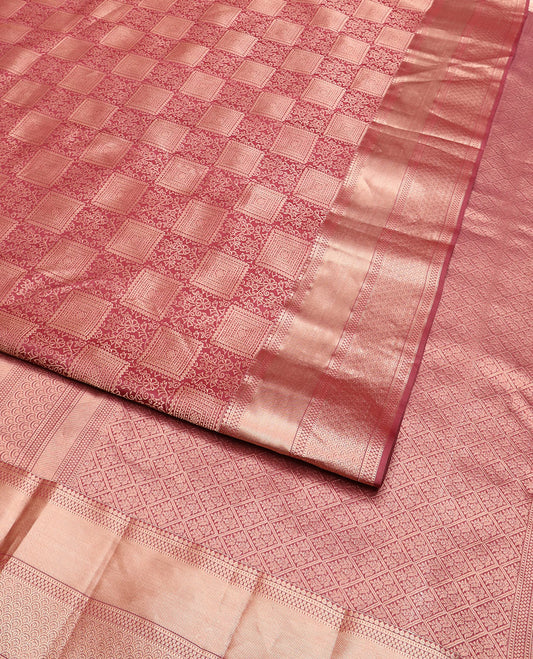 Pink jacquard Kanchipuram wedding silk saree, zari border of thilakam, muthu, paisa, and scallop designs, and jaal pallu
