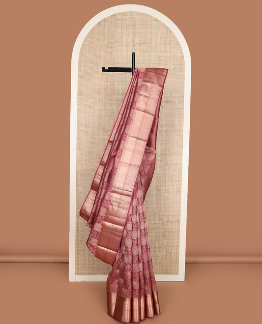 Pink jacquard Kanchipuram wedding silk saree, zari border of thilakam, muthu, paisa, and scallop designs, and jaal pallu