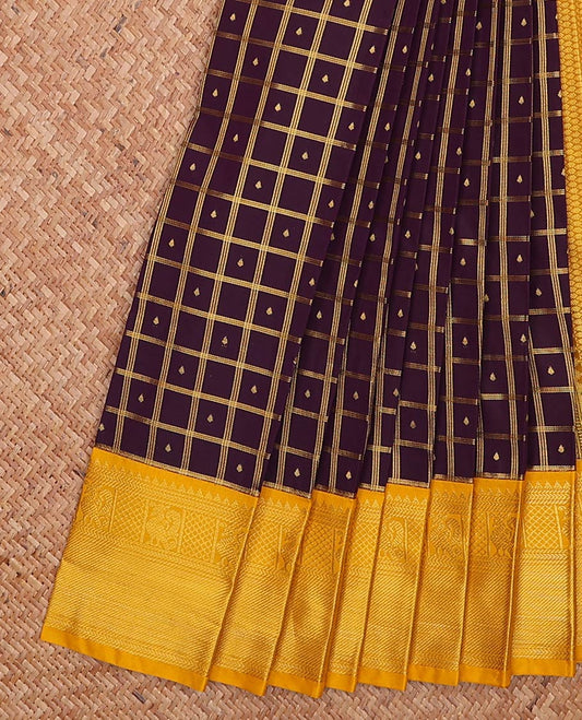 Maroon butta enclosed checked gift saree, contrast traditional zari design border, and jaal pallu