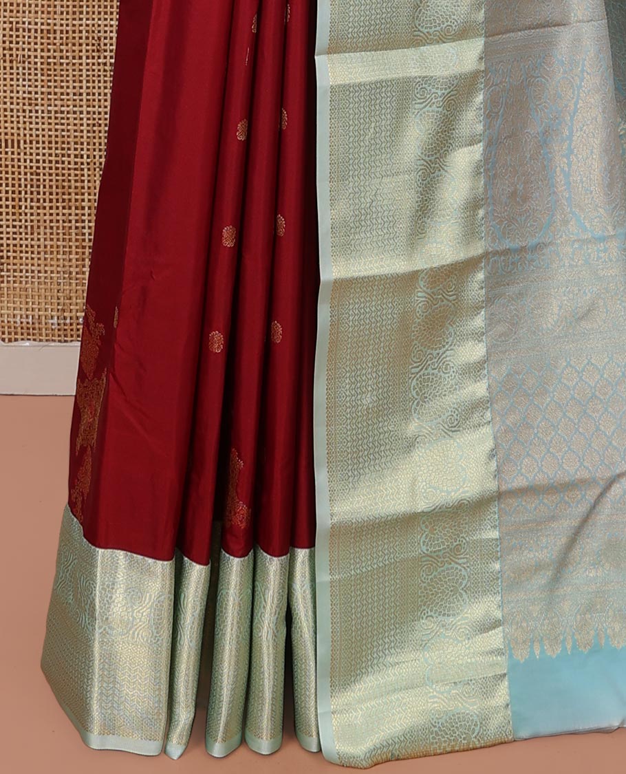 Red Budget Silk Saree, Elegantly Highlighted  with Zari Buttas All Over Its Body, Complemented by a Contrast Traditional Zari Designs Woven Border, Opulently Embellished Pallu, and Paired with a Contrast Blouse