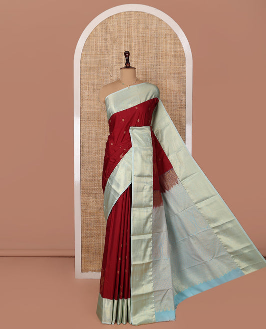 Red Budget Silk Saree, Elegantly Highlighted  with Zari Buttas All Over Its Body, Complemented by a Contrast Traditional Zari Designs Woven Border, Opulently Embellished Pallu, and Paired with a Contrast Blouse