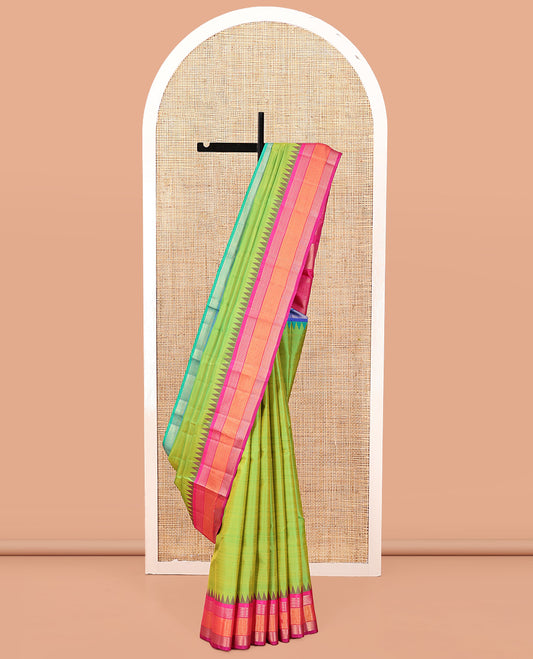 Parrot Green-Striped Bangalore Silk Saree, Complemented by a Contrast Temple Ganga-Jamuna Border, Pallu of Temple and Neli Designs, and a Contrast Blouse