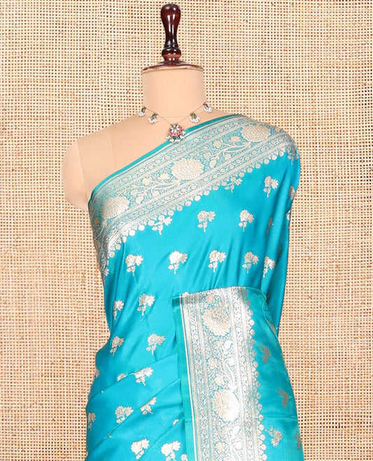 Blue Banarasi Nylon Saree, Elevated with Floral Buttas, Zari Floral Creeper Border, Intricate Pallu, and a Matching Blouse
